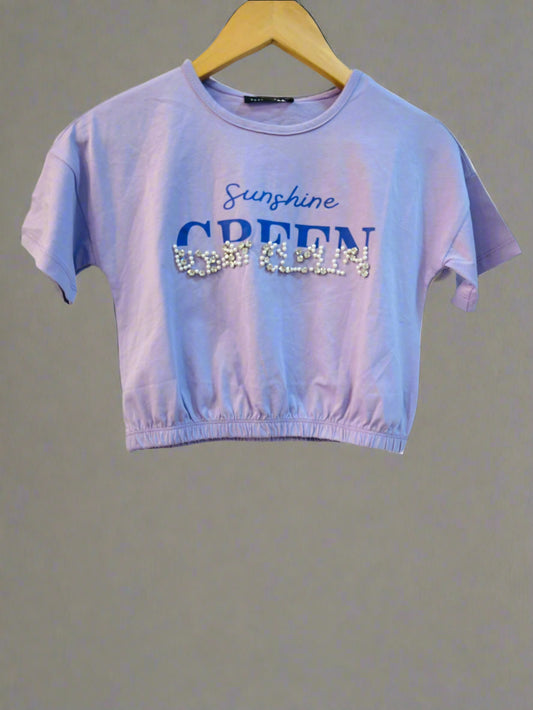 Luxe Thread cute kids crop top in light purple with glittery green text and elastic hem