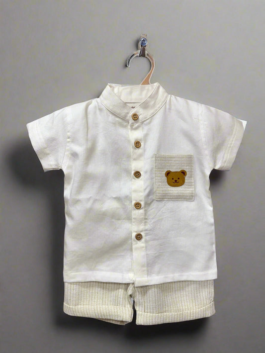 Beige khaki baby outfit featuring a short-sleeve shirt with bear pocket and matching shorts